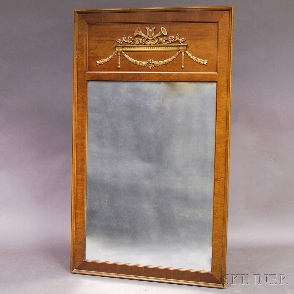 Appraisal: Neoclassical-style Walnut Mirror the recessed panel with applied carvings depicting