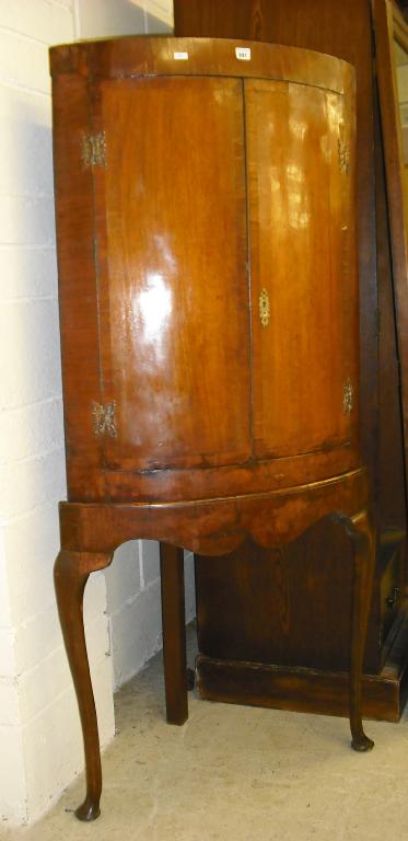 Appraisal: th century rosewood bowfronted cabinet on stand with two crossbanded