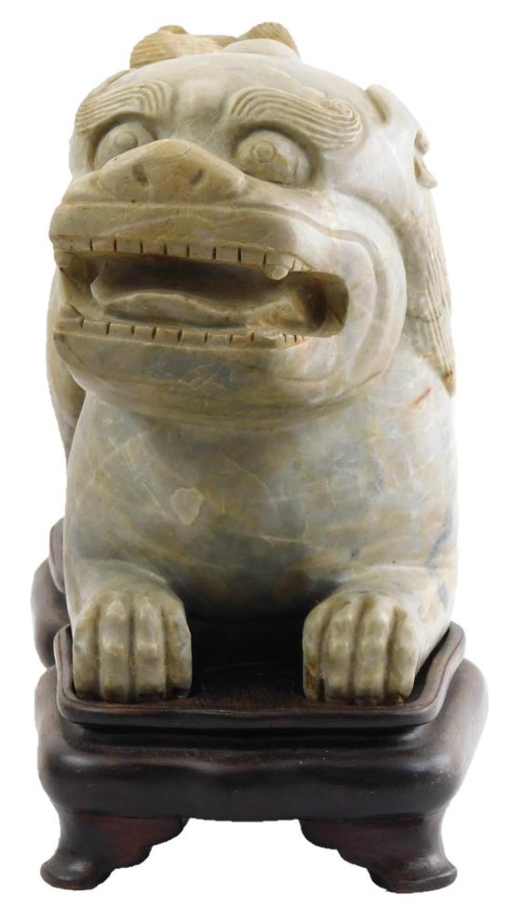 Appraisal: ASIAN Chinese hardstone Foo dog Qing Dynasty or later reclining