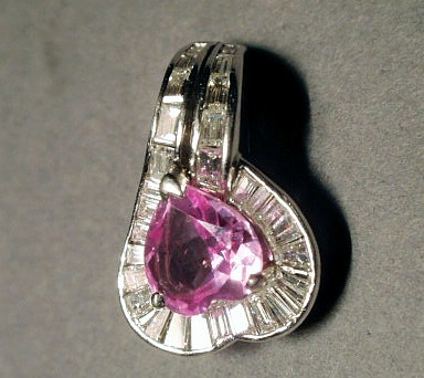 Appraisal: Platinum pink sapphire and diamond pendant center heart cut pink