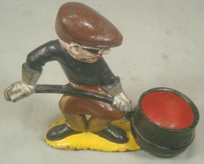 Appraisal: Cast iron doorstop iron worker with gloves and goggles on