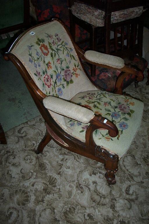 Appraisal: A Victorian elbow chair with floral tapestry seat and back