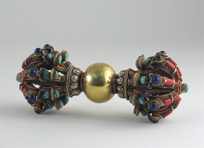 Appraisal: A Himilayan mixed metal vajra inlaid with lapis lazuli coral