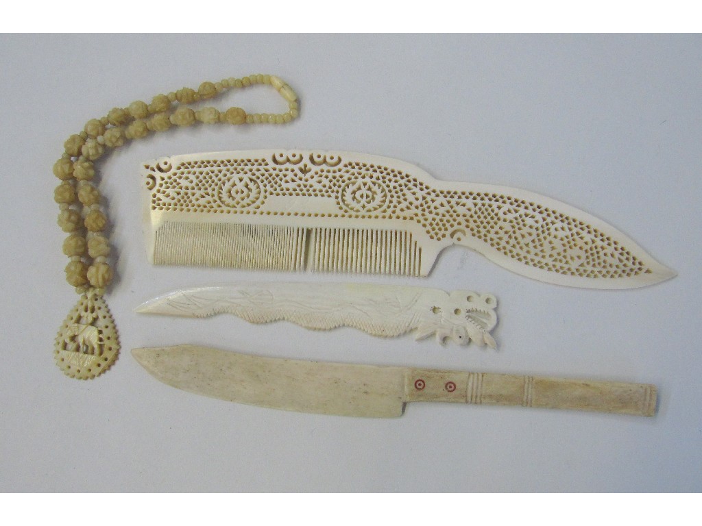 Appraisal: Lot comprising assorted ivory items - comb letter opener necklet