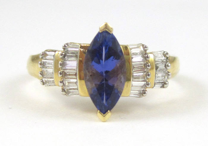 Appraisal: TANZANITE DIAMOND AND EIGHTEEN KARAT GOLD RING with baguette-cut diamonds