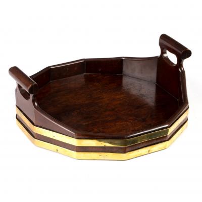 Appraisal: A George III mahogany brass bound tray with two pierced