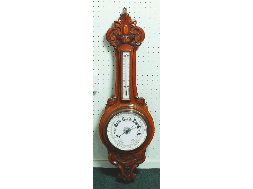 Appraisal: LATE VICTORIAN CARVED OAK ANEROID WHEEL BAROMETER the enamelled dial