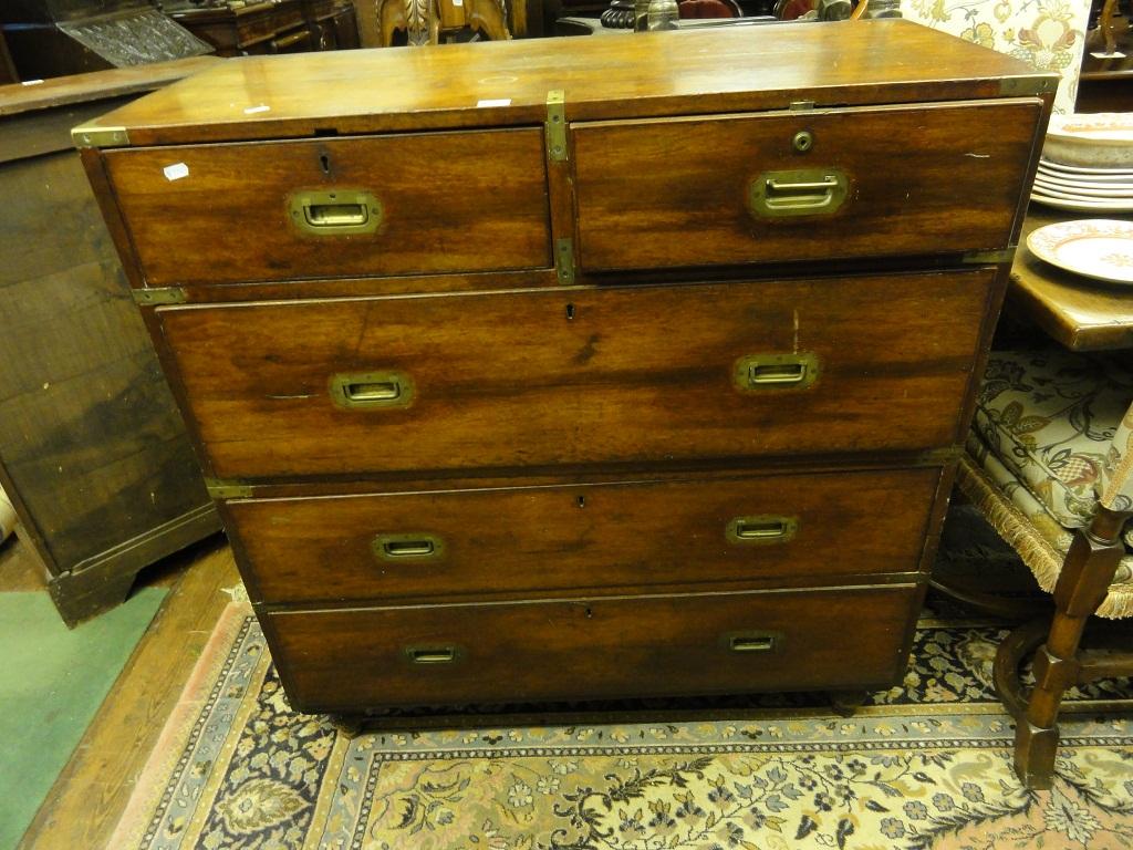 Appraisal: A th century mahogany two sectional campaign chest fitted with