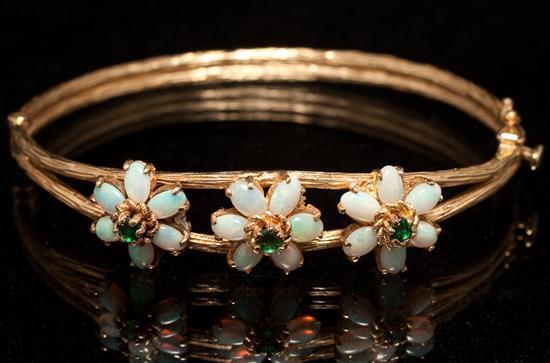 Appraisal: Lady's K yellow gold opal and emerald bangle bracelet grams