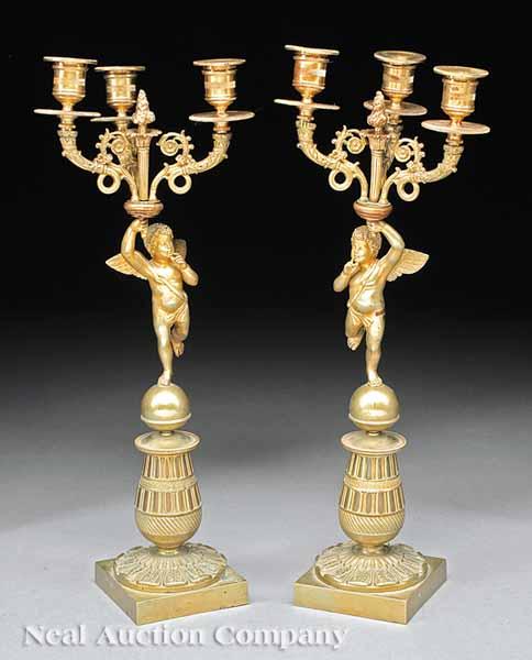 Appraisal: A Pair of Louis Philippe Gilt Bronze Figural Three-Light Candelabra