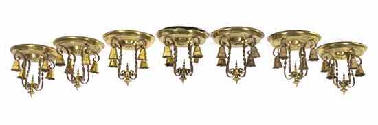 Appraisal: A Set of Seven Brass Ceiling Mount Four-Light Fixtures each