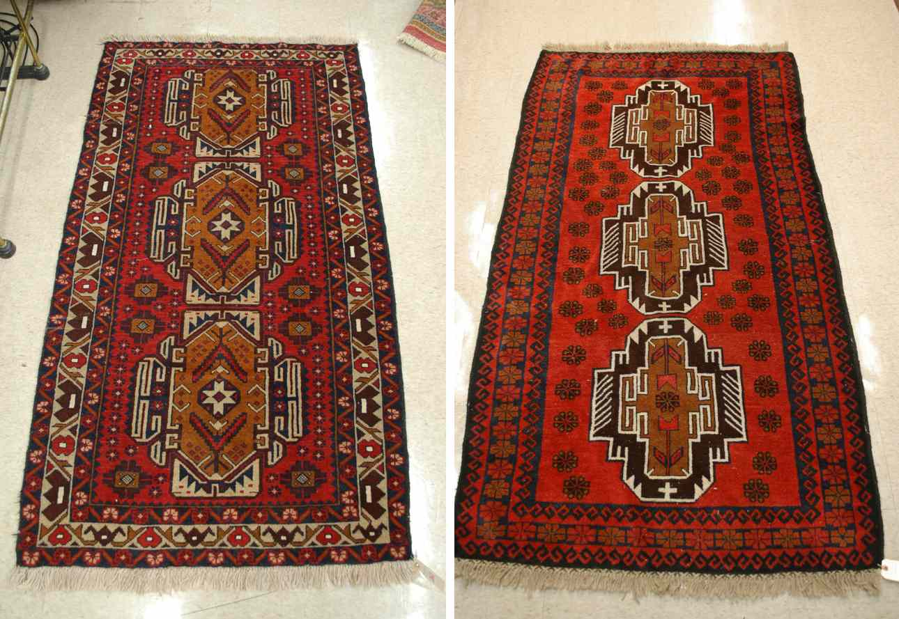 Appraisal: TWO BELOUCHI TRIBAL AREA RUGS both featuring a column of