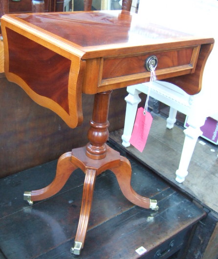 Appraisal: A Regency design mahogany and walnut drop flap occasional table