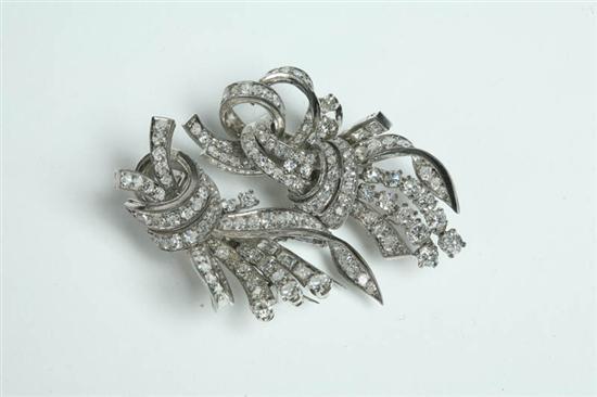 Appraisal: DIAMOND BROOCH DRESS CLIPS Stylized bows combine to form a