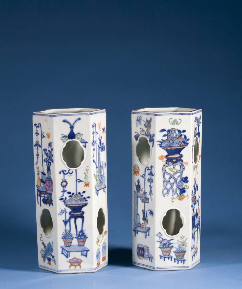 Appraisal: PAIR OF CHINESE PORCELAIN WIG STANDS Each painted with arrangements