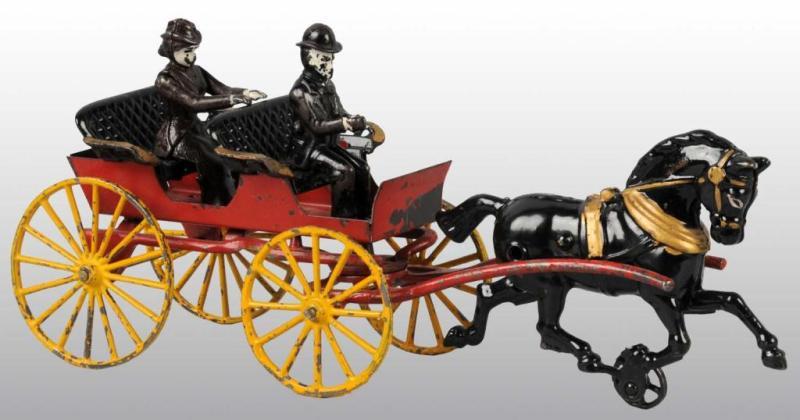 Appraisal: Cast Iron Hubley Horse-Drawn Surrey Toy Description Pulled by a