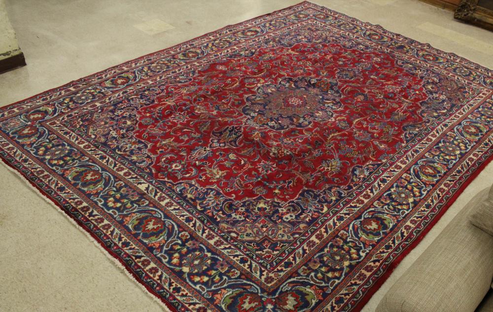 Appraisal: HAND KNOTTED PERSIAN CARPET floral and central floral medallion design