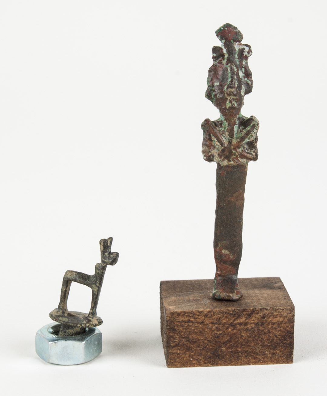 Appraisal: Two ancient Egyptian bronze objects comprising a bronze bottle stopper