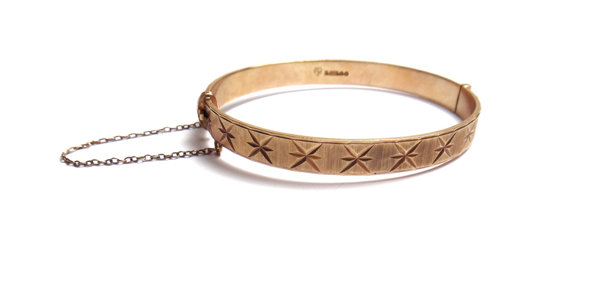 Appraisal: A ct gold oval hinged bangle with star cut and