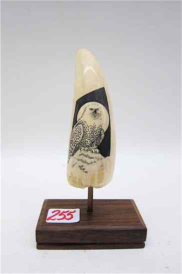 Appraisal: IVORY WHALE'S TOOTH scrimshawed with a snowy owl fronting a