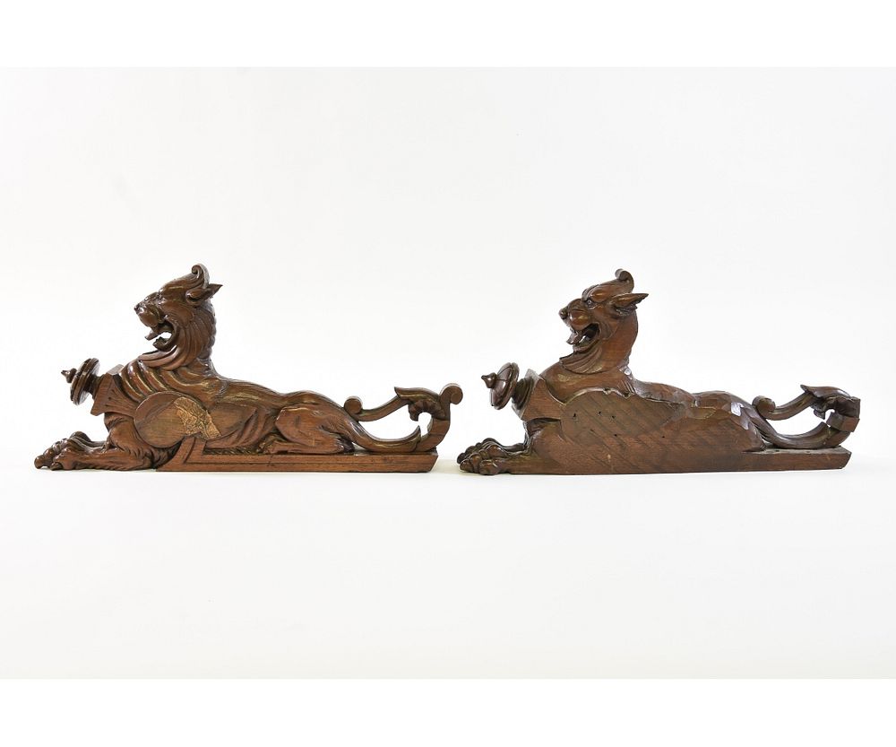 Appraisal: Pair of Carved Walnut Griffins Pair of walnut carved recumbent