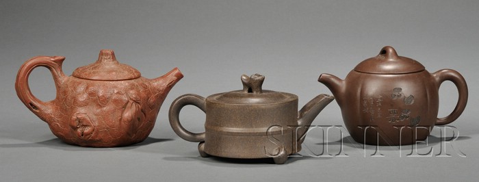 Appraisal: Three Yixing Teapots China one with simple design of a