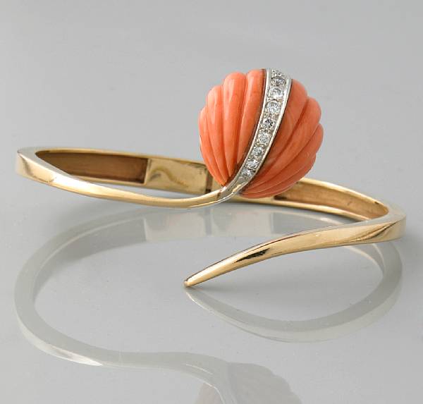 Appraisal: A coral diamond and k gold bangle with a single