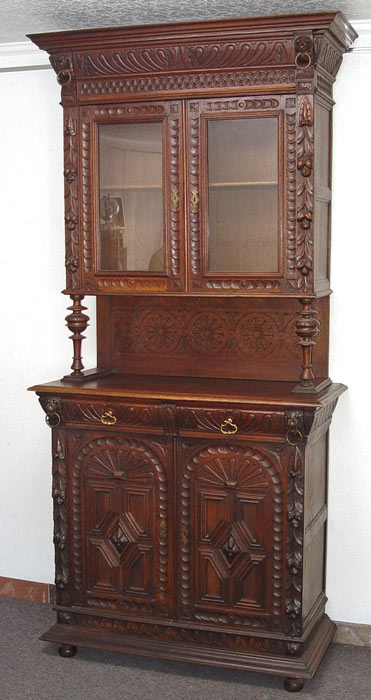 Appraisal: BELGIUM ORNATELY CARVED SIDEBOARD CUPBOARD Fabulously carved walnut cupboard Pair