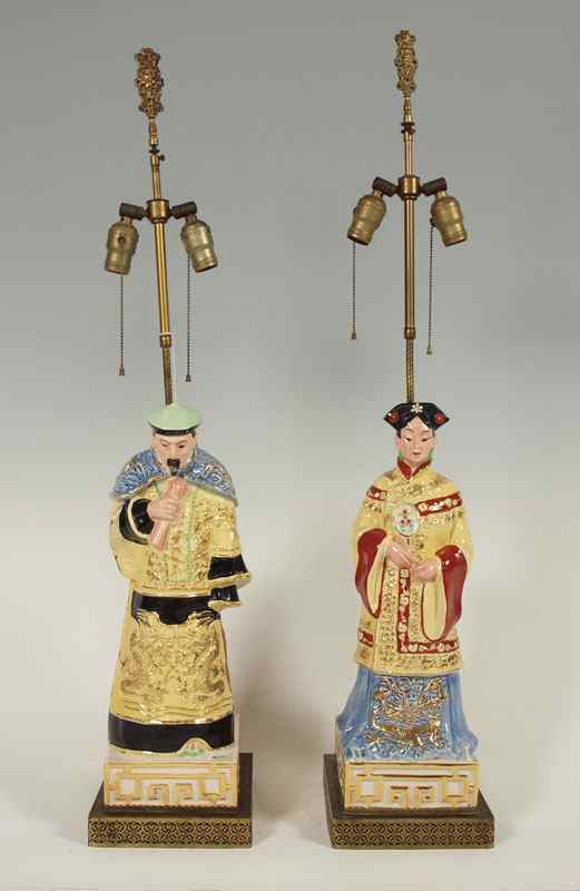 Appraisal: PAIR PORCELAIN LAMPS IN THE CHINESE STYLE Figural man and