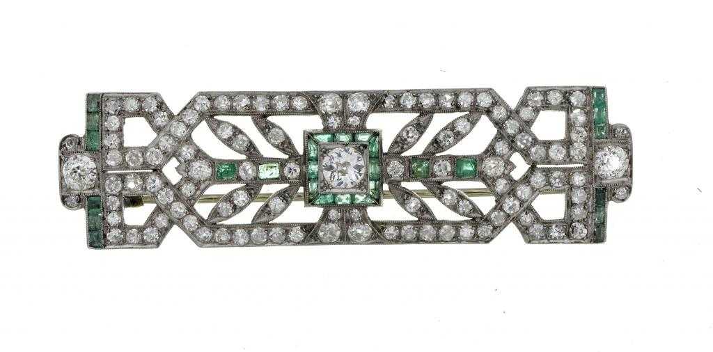 Appraisal: AN EMERALD AND DIAMOND BROOCH of geometric entwined design the