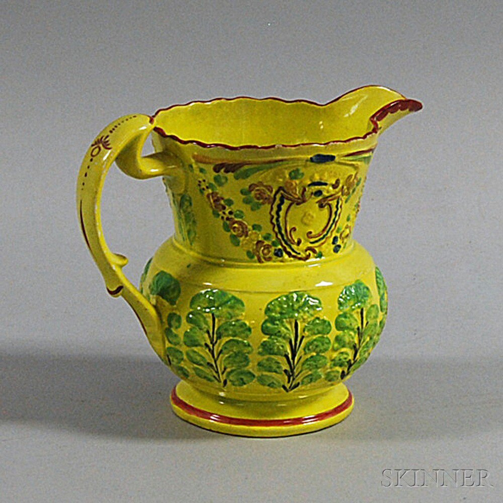 Appraisal: Polychrome Prattware Pitcher th century with floral festoons and molded