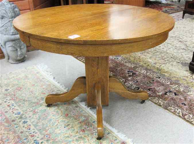 Appraisal: ROUND OAK PEDESTAL DINING TABLE WITH TWO LEAVES American c