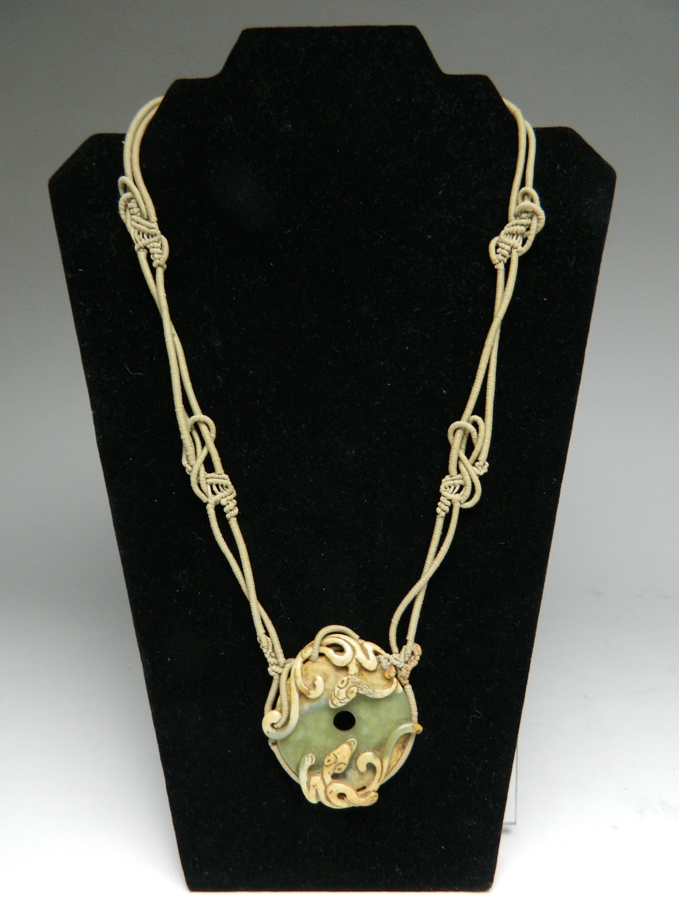 Appraisal: Simone Samuels American - Macrame and jade pendant necklace intricately