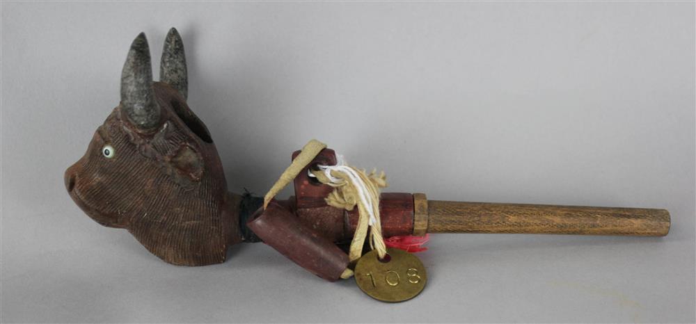 Appraisal: CATLINITE CARVED PIPE with bison head effigy and wooden stem