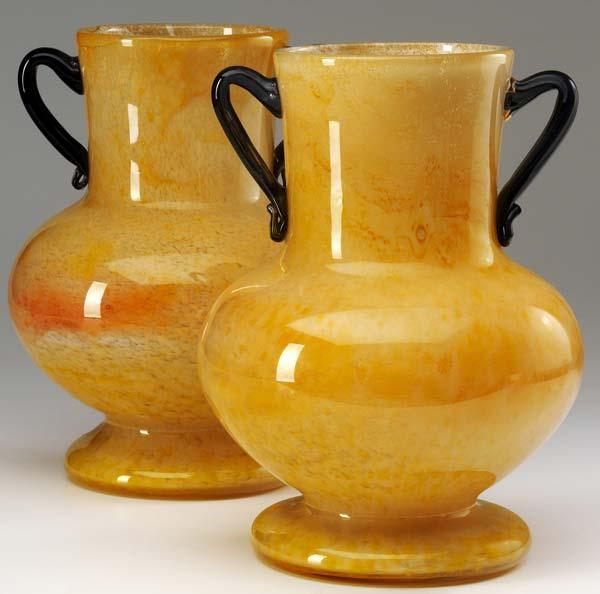 Appraisal: DURAND Pair of orange Cluthra urn-shaped vases with black handles