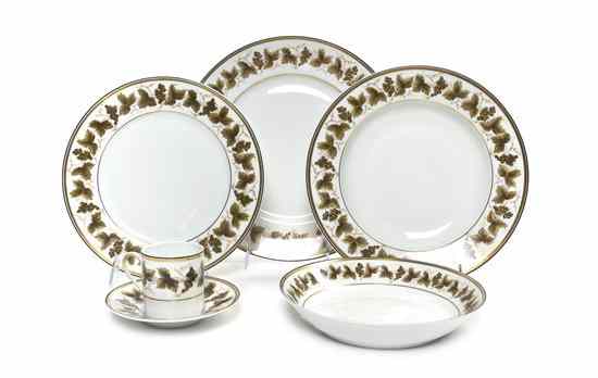 Appraisal: A Partial French Porcelain Dinner Service Limoges with leaf and