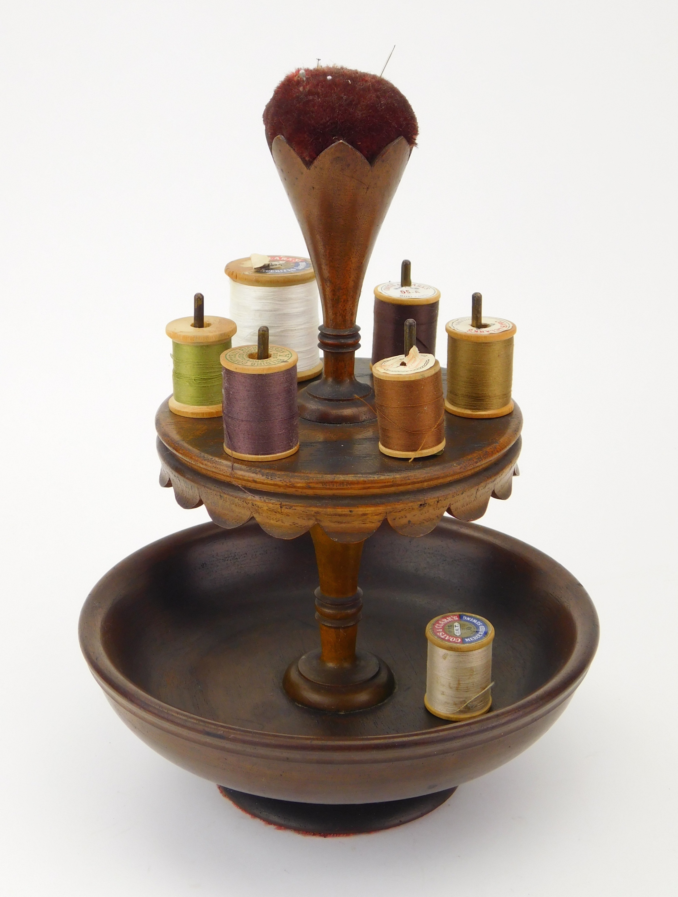 Appraisal: Victorian walnut spool holder and pin cushion top is maroon