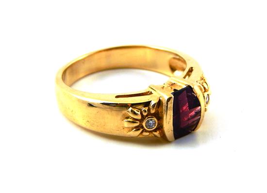 Appraisal: JEWELRY Garnet and diamond ring stamped and tested K yellow