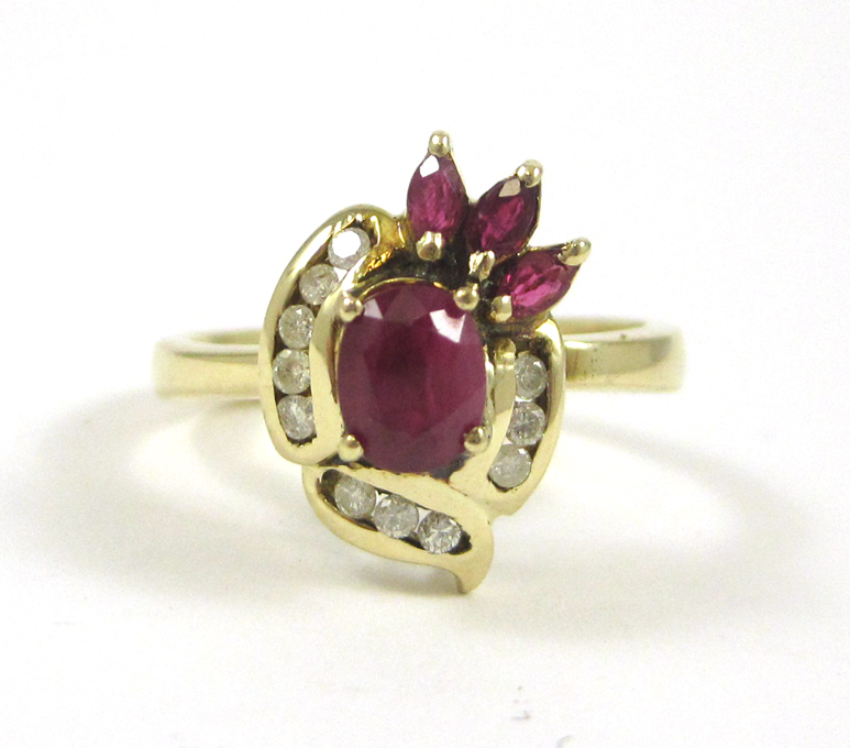 Appraisal: RUBY DIAMOND AND FOURTEEN KARAT GOLD RING with three marquise-cut