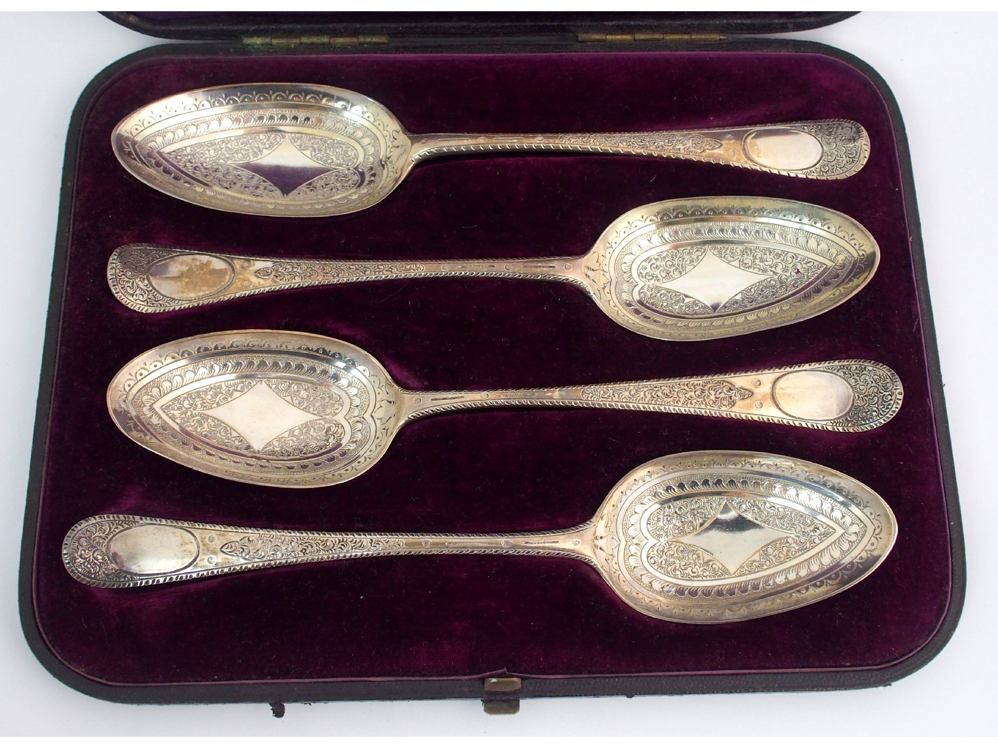 Appraisal: A cased harlequin set of four Georgian silver tablespoonsby Thomas