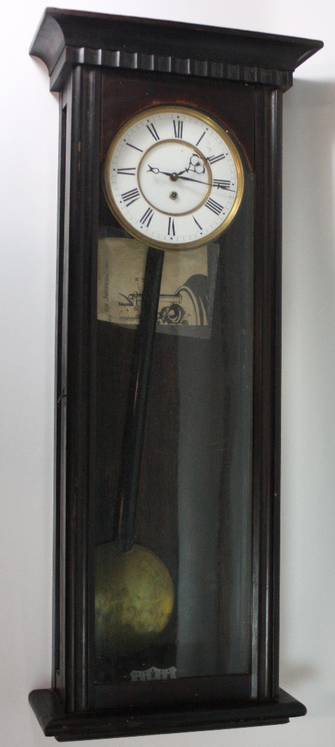 Appraisal: A Vienna style wall timepiece circa in stained as mahogany