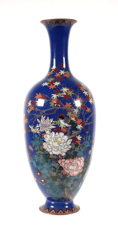 Appraisal: Tall Japanese silver and enamel with blue background vase featuring