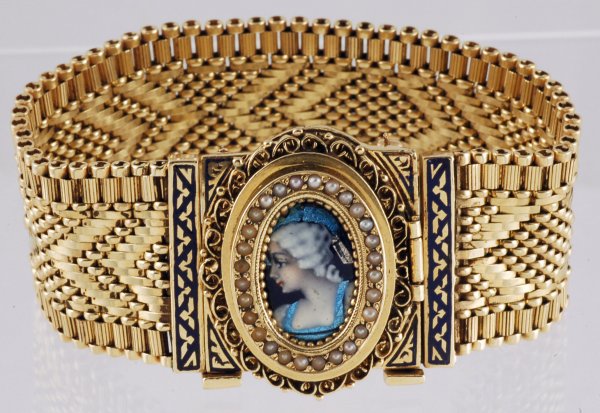 Appraisal: K yellow gold watch in an ornate rectangular case accented