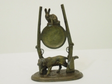 Appraisal: Hunter s hutch with hound rabbit and gun height This