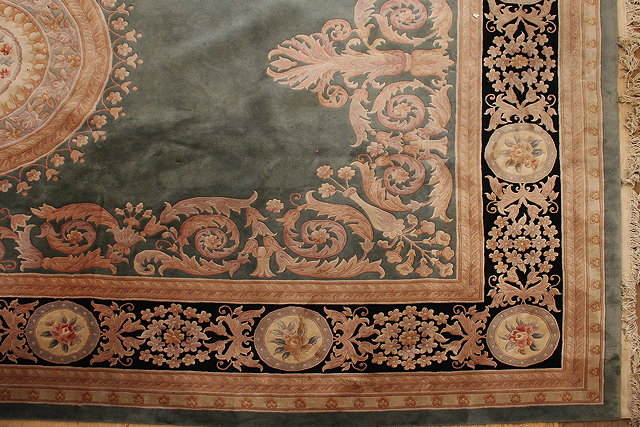 Appraisal: A CHINESE CARPET the celadon ground with central medallion within