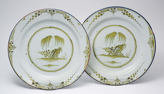 Appraisal: A PAIR OF UNUSUAL GREEN GLAZED DELFT DISHES with central