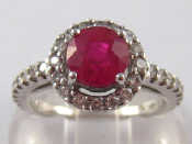 Appraisal: A white metal tests carat gold ruby and diamond ring