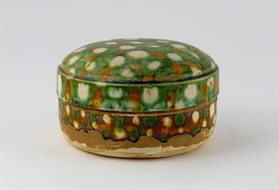 Appraisal: A Chinese sancai-glazed circular box and cover decorated with a