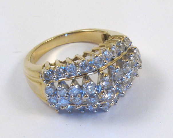 Appraisal: DIAMOND AND FOURTEEN KARAT GOLD RING set with round-cut diamonds