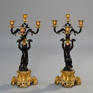 Appraisal: Pair of th C French cherub four branch candelabra in